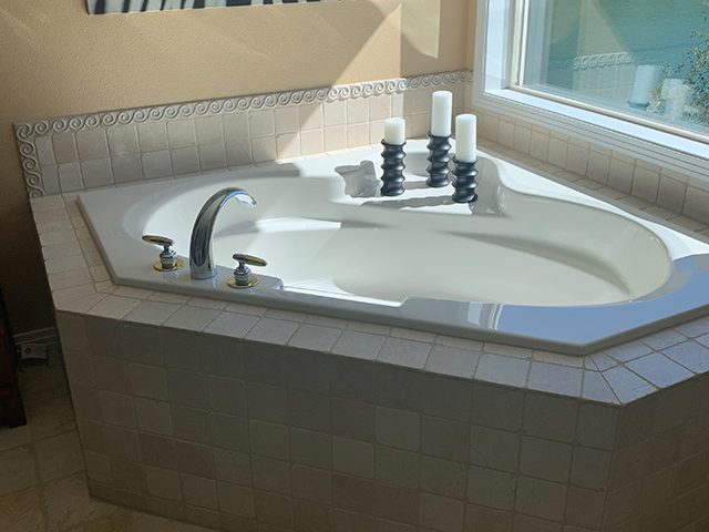 Before image of a bathtub, showcasing the original condition prior to any enhancements or improvements
