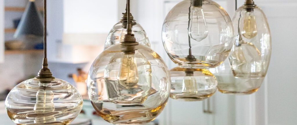 A close up of an interesting light fixture with clear orbs to show easy ways to update your home.