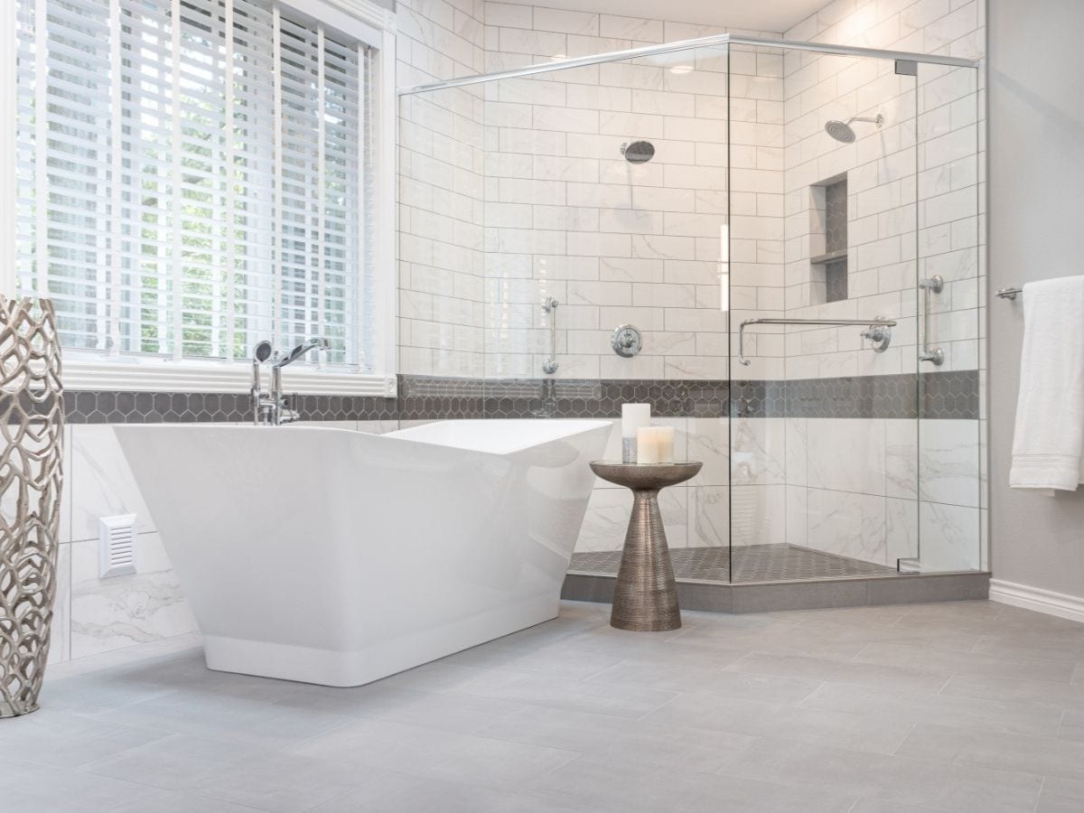 After shot of a gray bathroom tub, revealing a beautifully renovated space with updated features and enhanced aesthetics