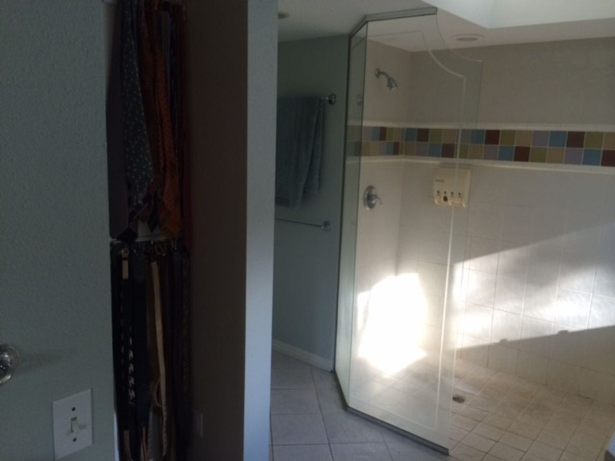 An outdated shower before a luxury bathroom remodel by Metke Home Remodeling